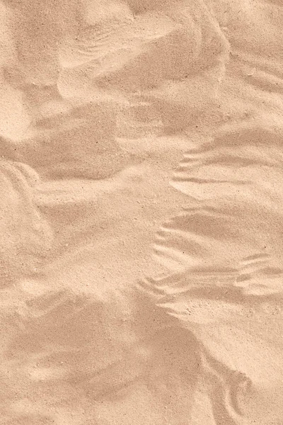 Areia de praia dourada no dia ensolarado como fundo — Fotografia de Stock
