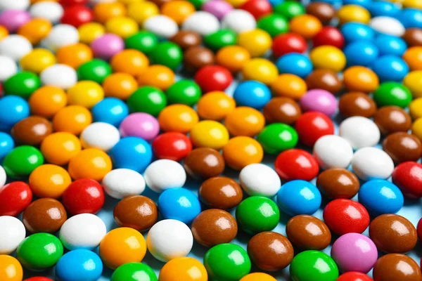 Muchos dulces deliciosos coloridos como fondo, primer plano — Foto de Stock