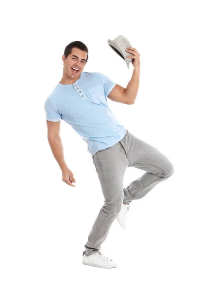 Handsome young man with hat dancing on white background — Stock Photo, Image