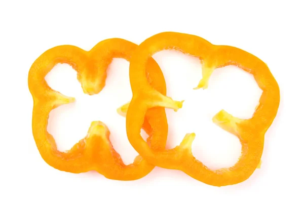 白い背景にオレンジピーマンのリング、トップビュー — ストック写真