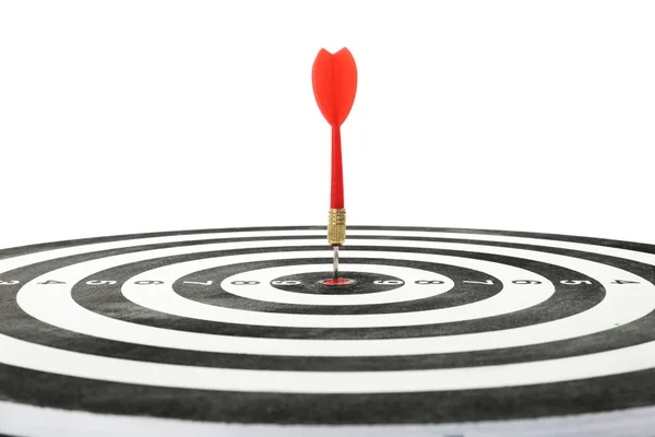 Red arrow hitting target on dart board against white background — Stock Photo, Image