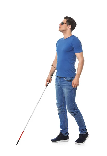Blind man with long cane on white background