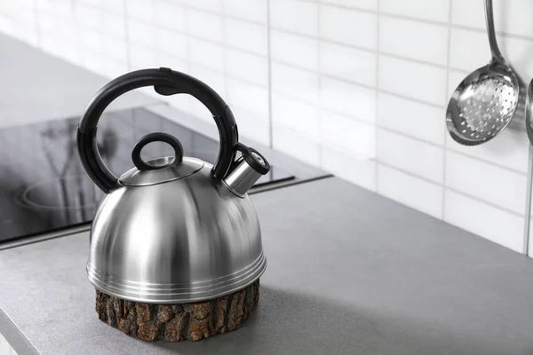 Modern kettle on kitchen counter indoors, space for text — Stock Photo, Image