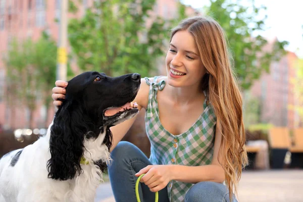 Young woman with her English Springer Spaniel dog outdoors — Stock Photo, Image