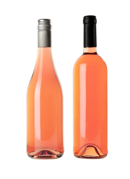 Botellas de delicioso vino de rosas sobre fondo blanco. Burla para el diseño —  Fotos de Stock