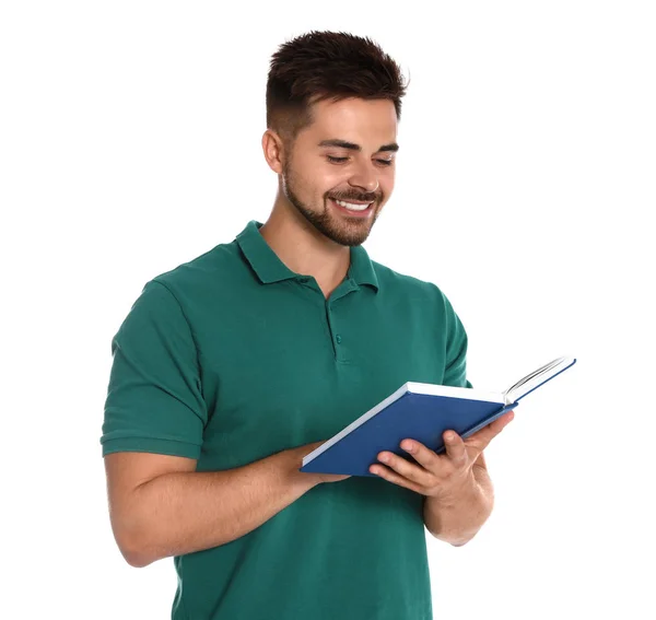 Schöner junger Mann liest Buch auf weißem Hintergrund — Stockfoto