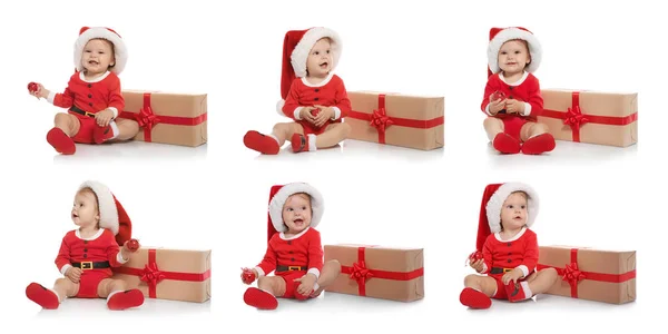 Ensemble de mignon petit bébé en costume de Noël et cadeau sur fond blanc — Photo