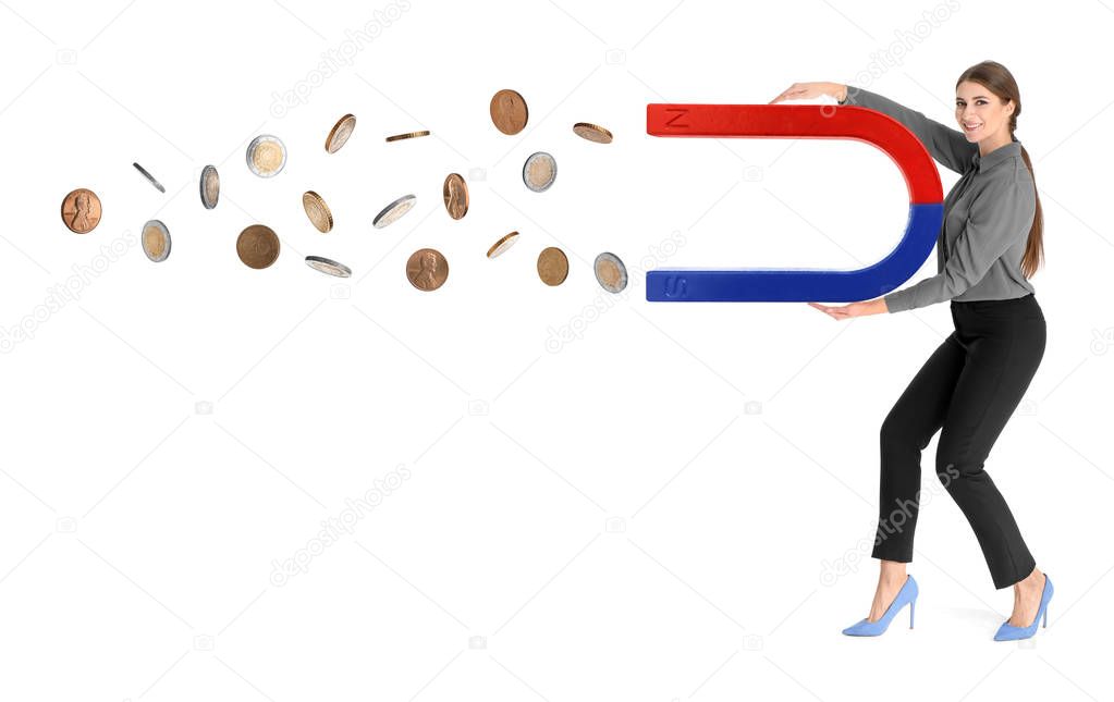 Young woman attracting money with magnet on white background
