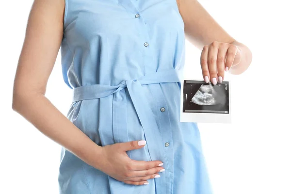 Pregnant woman with ultrasound picture on white background, closeup — Stock Photo, Image