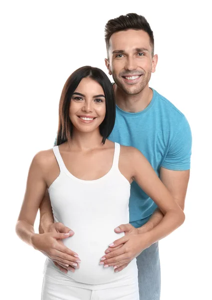 Joven familia feliz sosteniendo vientre embarazada sobre fondo blanco — Foto de Stock