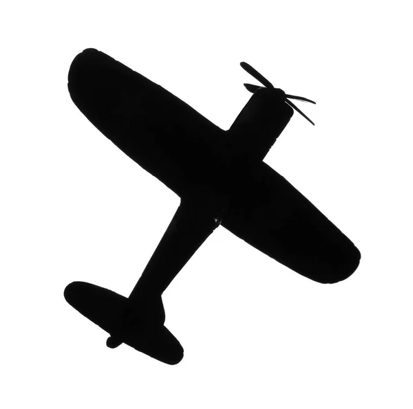 Silueta oscura de juguete vintage avión militar sobre fondo blanco — Foto de Stock