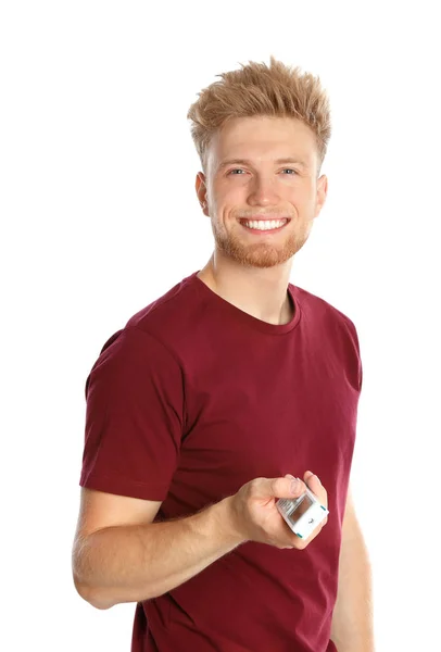 Молодой человек с дистанционным кондиционером на белом фоне — стоковое фото