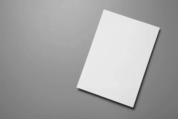 Blank paper sheets for brochure on grey background, top view. Mock up — Stock Photo, Image