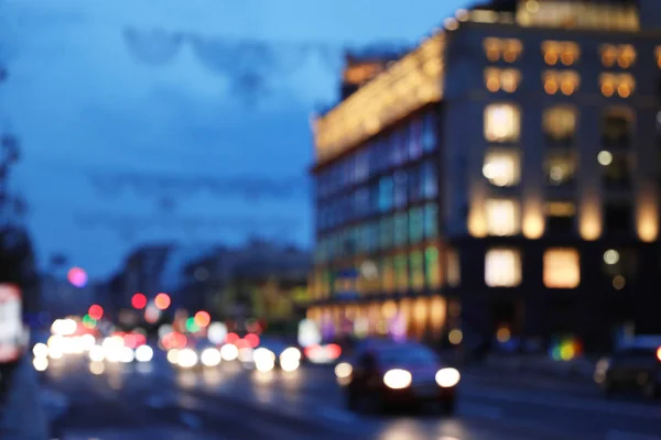 Vista borrosa de la ciudad moderna por la noche. Efecto Bokeh — Foto de Stock