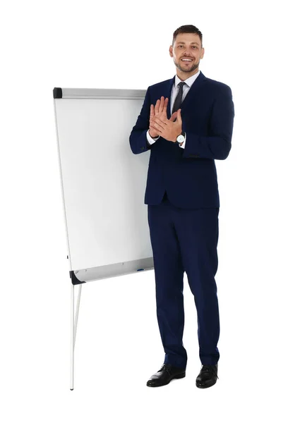 Professionele business trainer in de buurt van flip chart Board op witte achtergrond. Ruimte voor tekst — Stockfoto