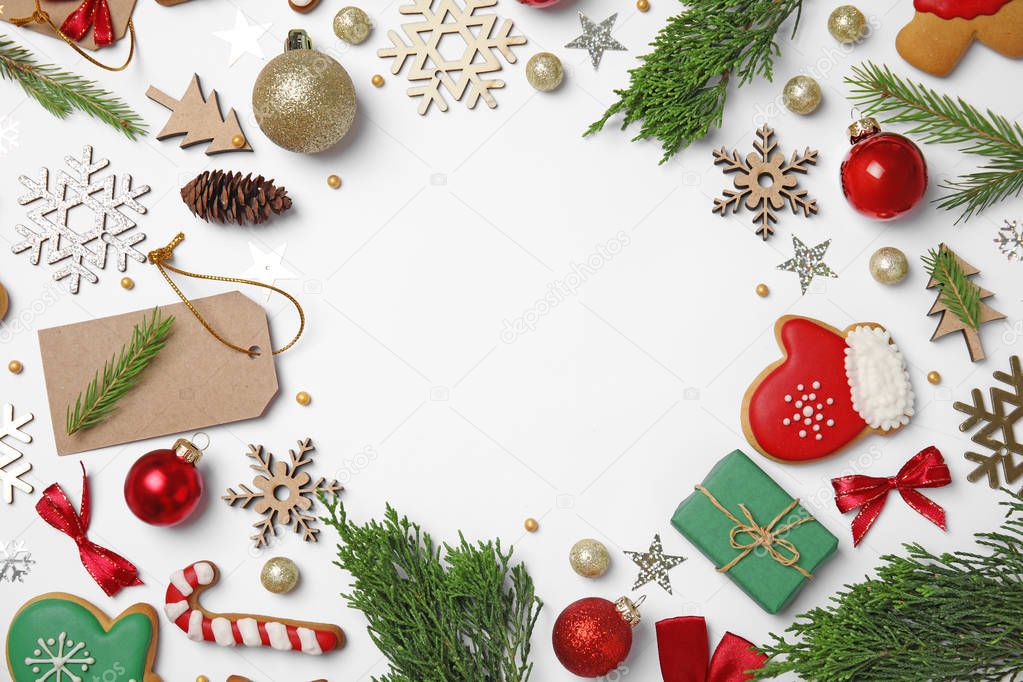 Frame made with Christmas decor on white background, top view. Space for text