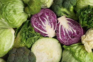 Different types of cabbage as background, top view clipart