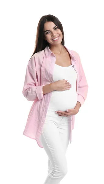 Happy pregnant woman holding her belly on white background — Stock Photo, Image