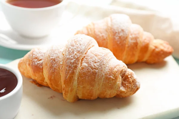 Marble board with tasty croissants and jam, closeup. French pastry — Stock Photo, Image