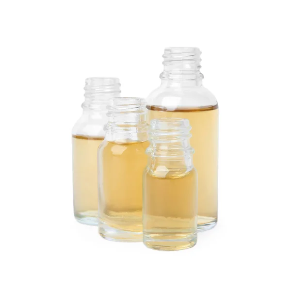 Glass bottles of essential oils on white background — Stock Photo, Image