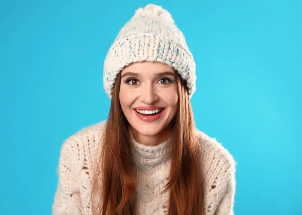 Young woman wearing Christmas sweater on blue background — Stock Photo, Image