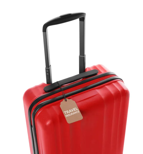 Valise rouge avec étiquette TRAVEL INSURANCE sur fond blanc — Photo