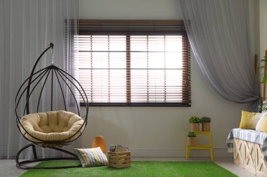 Salıncak sandalyeli şık ve modern oda iç mekan