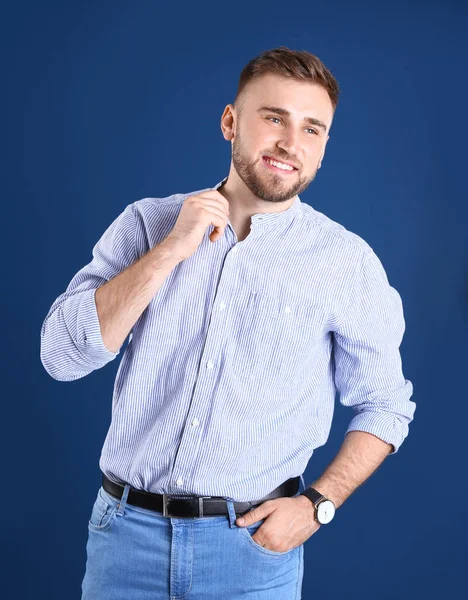 Portrait of handsome happy man on color background — Stock Photo, Image