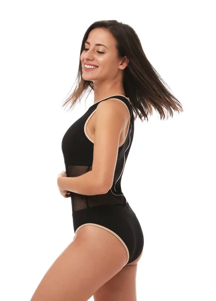 Αρκετά σέξι γυναίκα με λεπτό σώμα σε κομψό μαύρο μπικίνι σε λευκό φόντο — Φωτογραφία Αρχείου