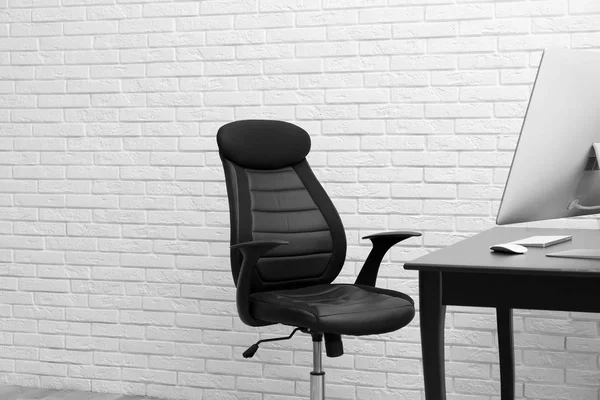Stylish workplace interior with modern office chair — Stock Photo, Image