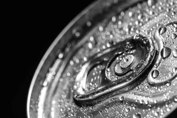Aluminum can of beverage covered with water drops on black background, closeup — Stock Photo, Image