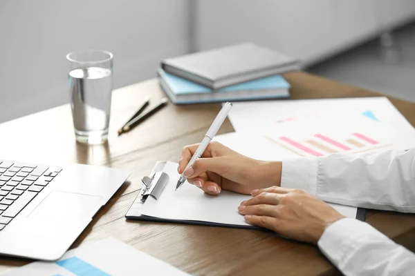 Business trainer working at table in office, closeup — Stock Photo, Image