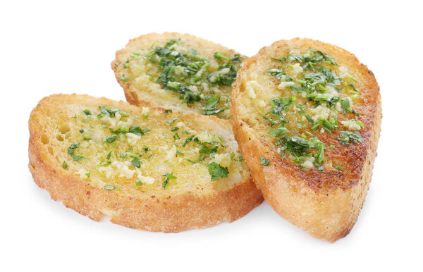 Slices of toasted bread with garlic and herb on white background