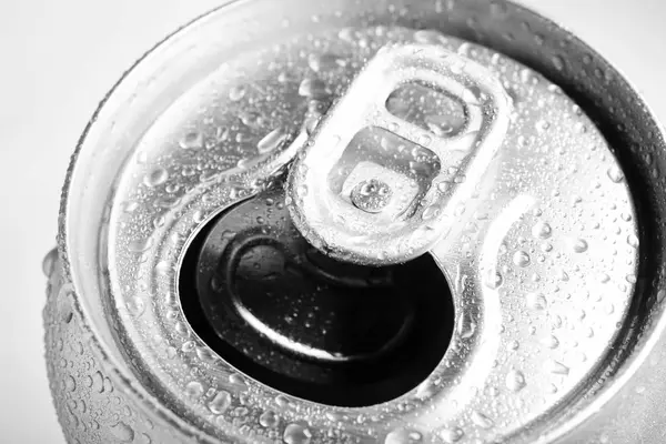 Wet open can with cold drink, closeup