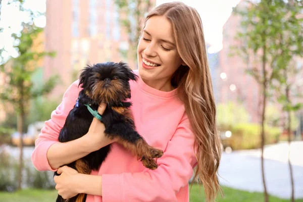 Young woman with adorable Brussels Griffon dog outdoors — Stock Photo, Image