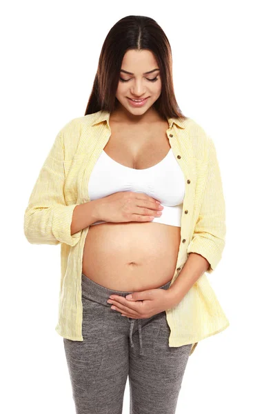 Portrait of beautiful young pregnant woman in shirt on white background — Stock Photo, Image