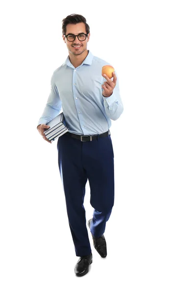 Fiatal férfi tanár könyvekkel és almával, fehér alapon — Stock Fotó