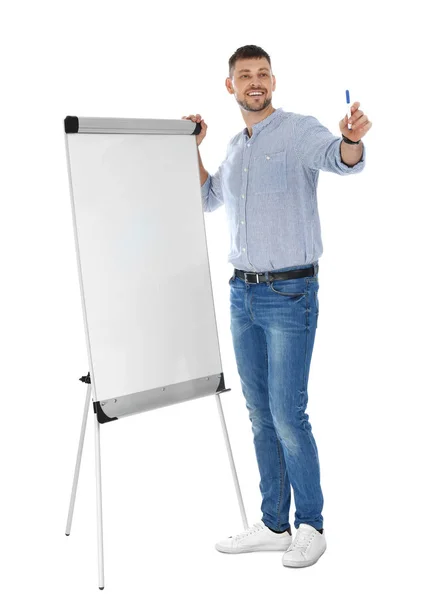 Trainer d'affari professionale vicino lavagna a fogli mobili su sfondo bianco. Spazio per testo — Foto Stock