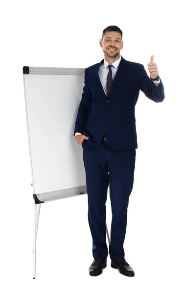 Professionele business trainer in de buurt van flip chart Board op witte achtergrond. Ruimte voor tekst — Stockfoto