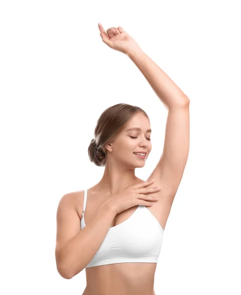 Mujer joven con axila lisa y limpia sobre fondo blanco. Uso de desodorante —  Fotos de Stock