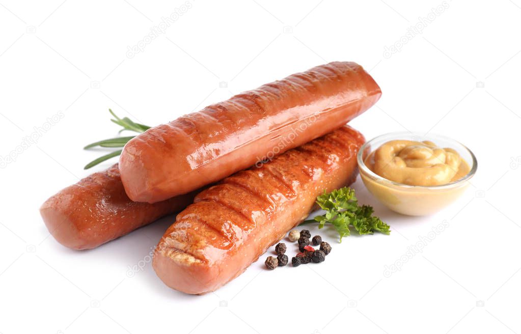 Delicious grilled sausages and sauce on white background. Barbecue food