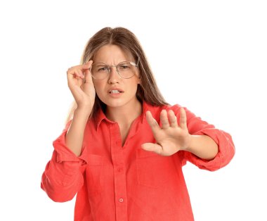 Young woman with vision problems wearing glasses on white background clipart
