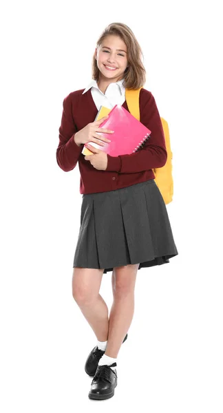 Menina feliz no uniforme da escola no fundo branco — Fotografia de Stock