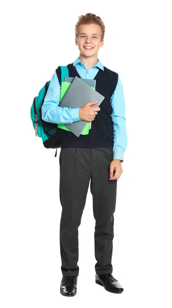 Menino feliz em uniforme escolar no fundo branco — Fotografia de Stock