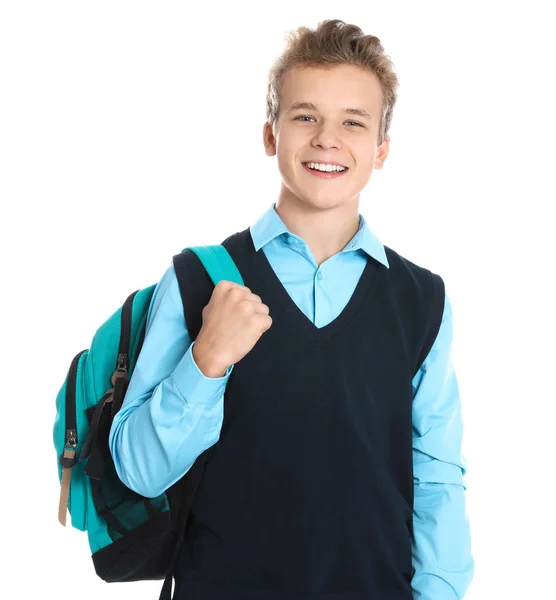 Lycklig pojke i skoluniform på vit bakgrund — Stockfoto