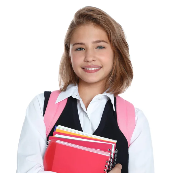 Felice ragazza in uniforme scolastica su sfondo bianco — Foto Stock