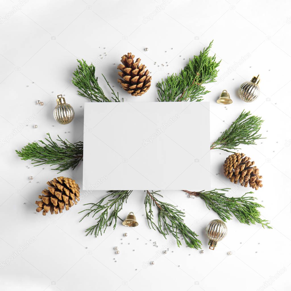 Composition with Christmas decor and blank card on white background, top view