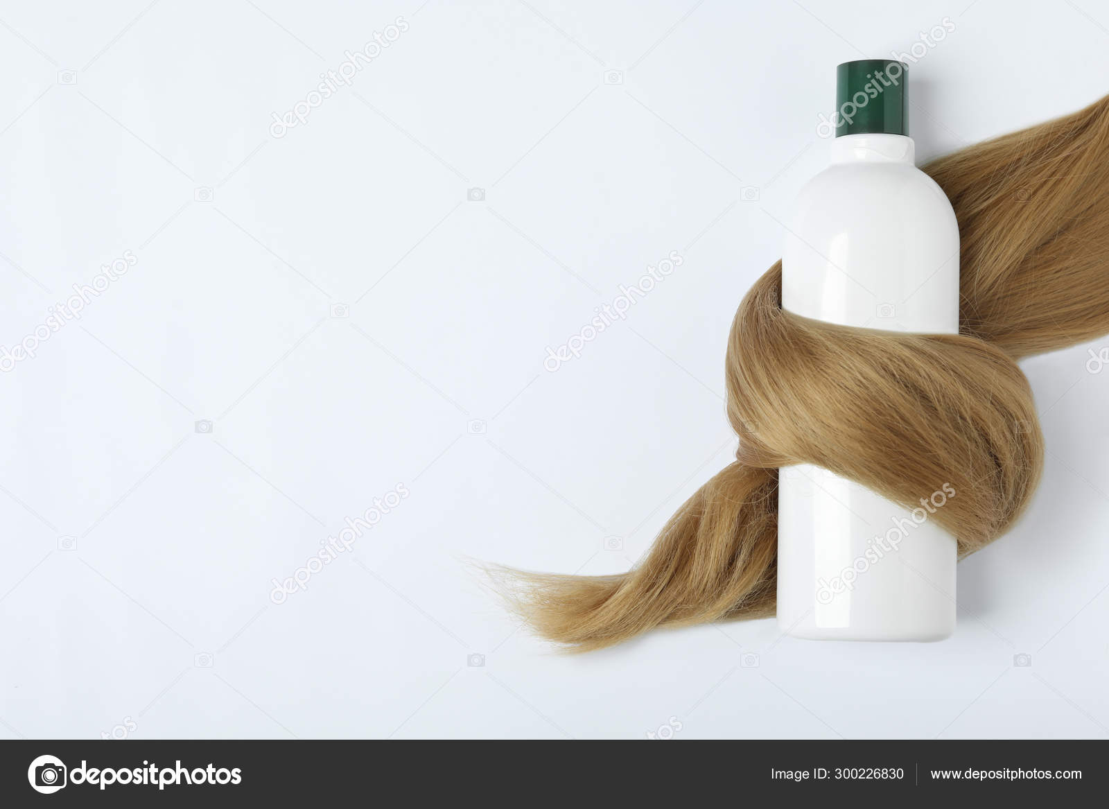 Shampoo Bottle Wrapped In Lock Of Hair Isolated On White Top View