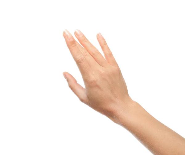 Mujer joven extendió la mano sobre fondo blanco, primer plano —  Fotos de Stock