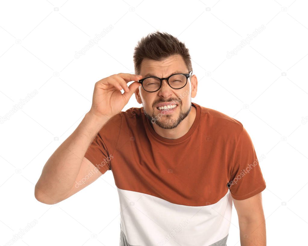 Man with vision problems wearing glasses on white background